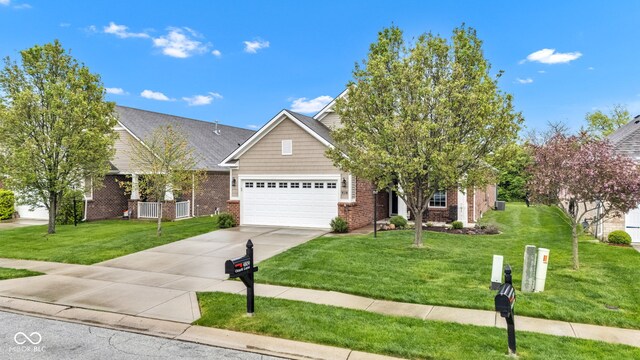 4809 Ozark Ln, Indianapolis, IN 46239 - view of front of property featuring a front yard, concrete driveway, an attached garage, and brick siding