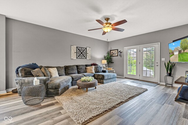 4809 Ozark Ln, Indianapolis, IN 46239 - living room with ceiling fan, light wood-style flooring, and baseboards