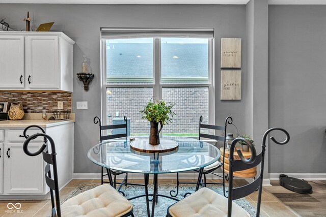4809 Ozark Ln, Indianapolis, IN 46239 - dining room featuring baseboards and light tile patterned floors