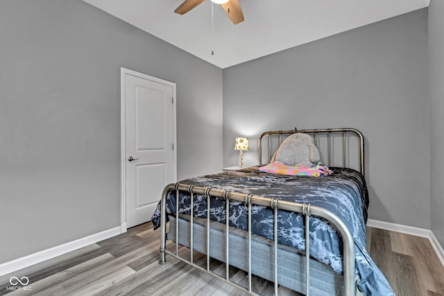 4809 Ozark Ln, Indianapolis, IN 46239 - bedroom with a ceiling fan, wood finished floors, and baseboards