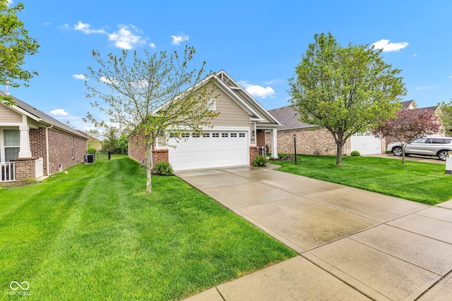 4809 Ozark Ln, Indianapolis, IN 46239 - single story home featuring a garage, brick siding, a front yard, and driveway