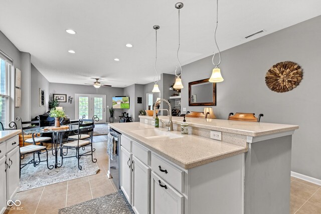 4809 Ozark Ln, Indianapolis, IN 46239 - kitchen with a kitchen island with sink, recessed lighting, a sink, ceiling fan, and stainless steel dishwasher