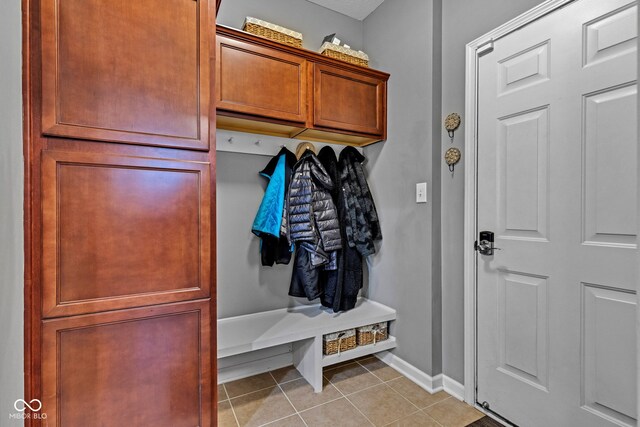 4809 Ozark Ln, Indianapolis, IN 46239 - mudroom featuring light tile patterned floors and baseboards