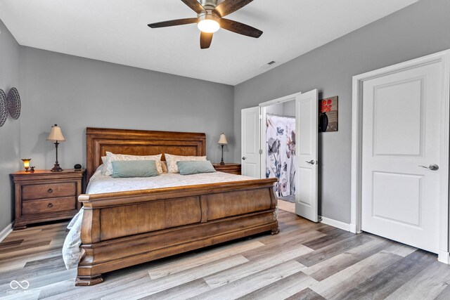 4809 Ozark Ln, Indianapolis, IN 46239 - bedroom featuring visible vents, light wood-style flooring, and baseboards