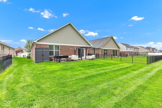 4809 Ozark Ln, Indianapolis, IN 46239 - rear view of house featuring a yard, a shed, brick siding, and a fenced backyard