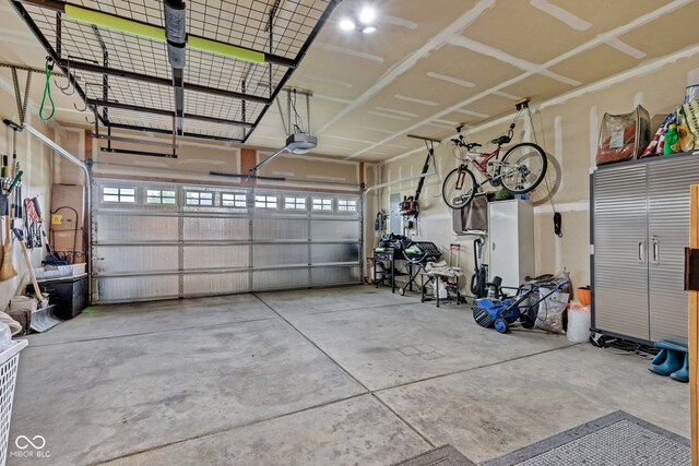 4809 Ozark Ln, Indianapolis, IN 46239 - garage featuring a garage door opener