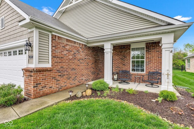 4809 Ozark Ln, Indianapolis, IN 46239 - ranch-style house with brick siding and a garage