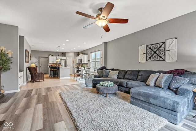 4809 Ozark Ln, Indianapolis, IN 46239 - living room with recessed lighting, ceiling fan, and light wood-type flooring