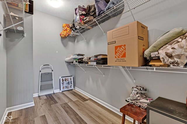 4809 Ozark Ln, Indianapolis, IN 46239 - walk in closet featuring wood finished floors