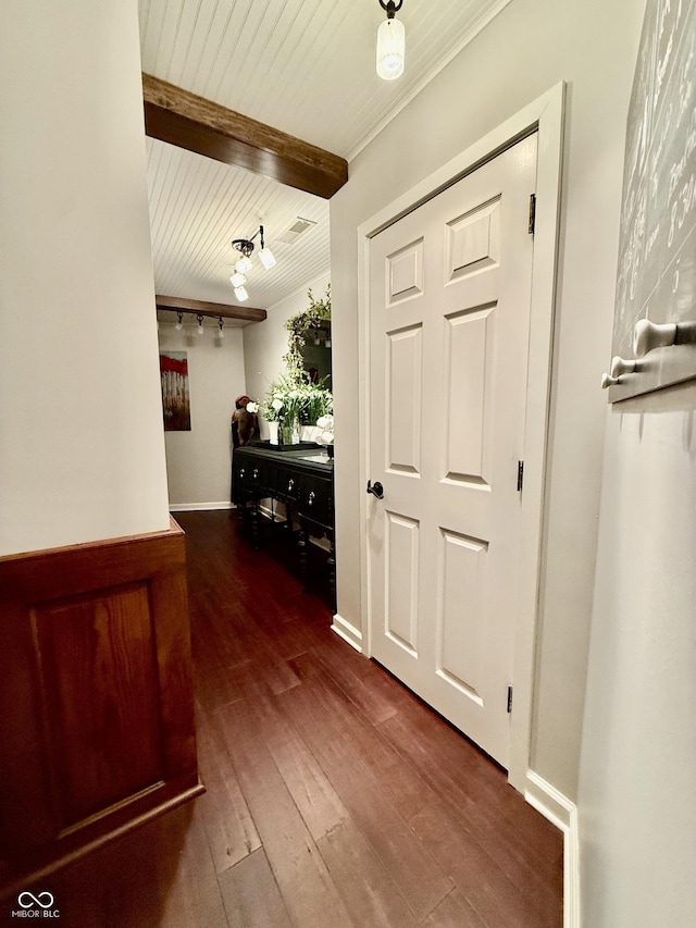 hallway featuring hardwood / wood-style floors, wooden ceiling, and beamed ceiling