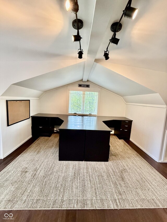 home office with track lighting, wood finished floors, and lofted ceiling