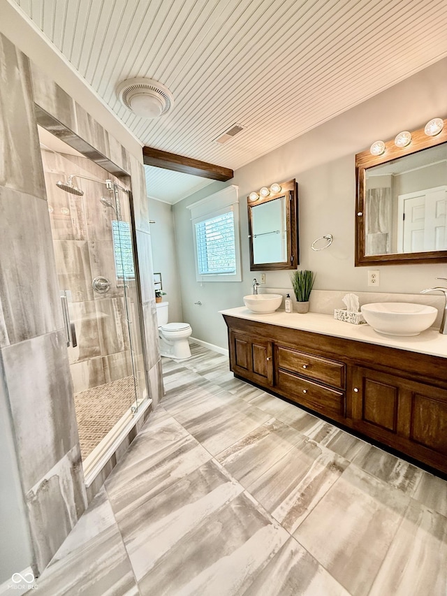 full bath featuring double vanity, visible vents, a shower stall, and a sink