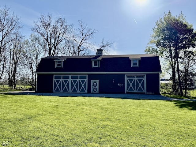 view of barn featuring a lawn