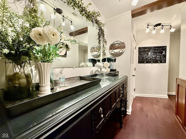 interior space with crown molding, wooden ceiling, wood finished floors, and baseboards