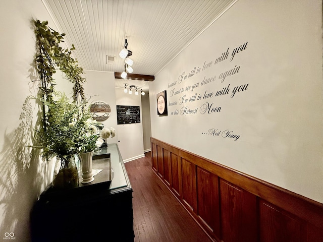 hall with wainscoting, dark wood-type flooring, and wood ceiling