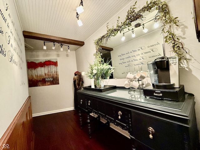 interior space with beam ceiling, track lighting, baseboards, wood ceiling, and wood finished floors