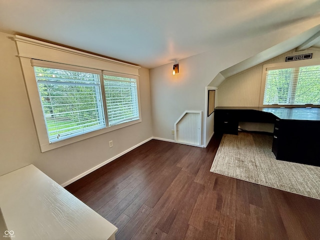 interior space with wood finished floors and baseboards