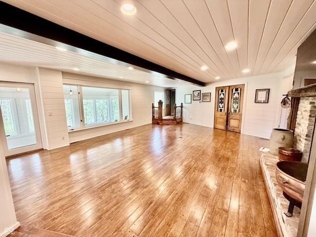 living area with recessed lighting and light wood-style flooring