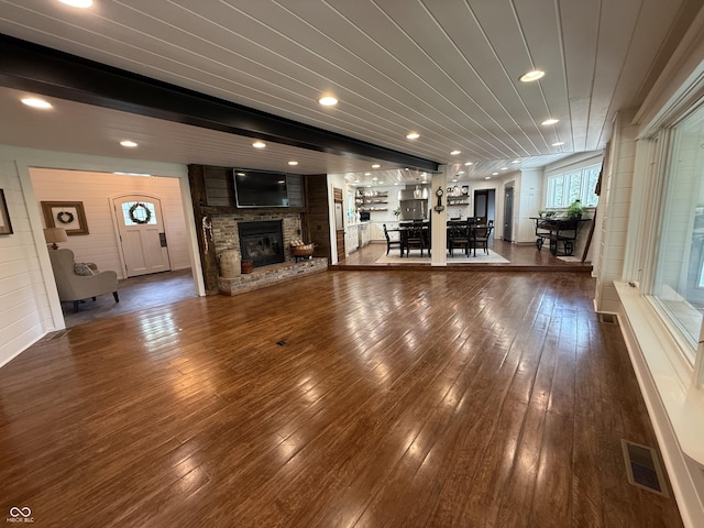 unfurnished living room featuring recessed lighting, visible vents, hardwood / wood-style floors, and a fireplace