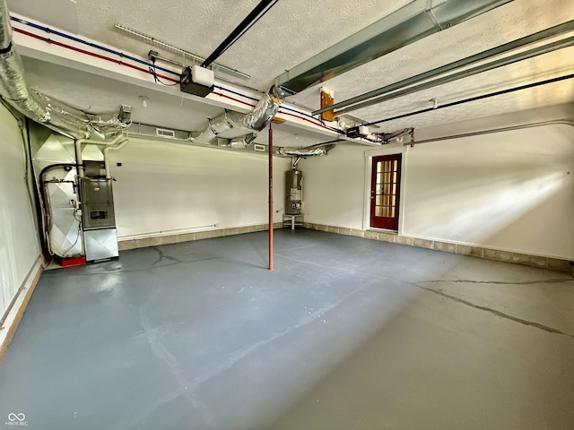 garage with a garage door opener and water heater