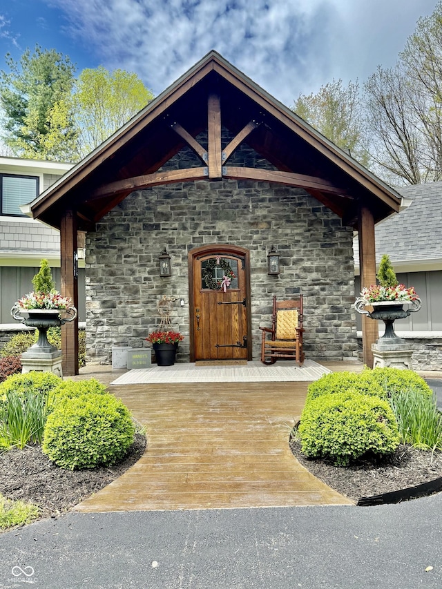 entrance to property with stone siding