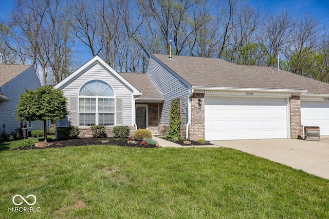 single story home with brick siding, a front lawn, concrete driveway, and an attached garage
