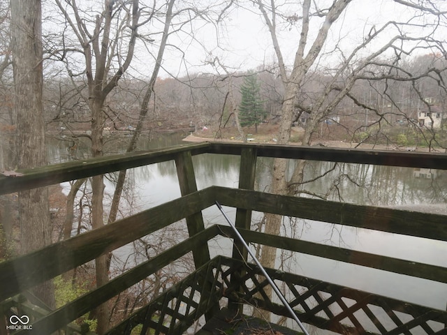 wooden terrace featuring a water view