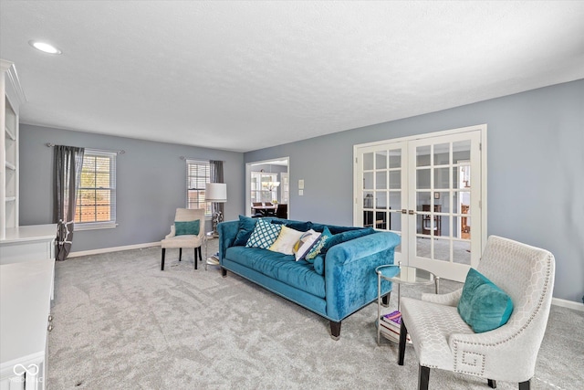 living area with french doors, recessed lighting, baseboards, and carpet floors