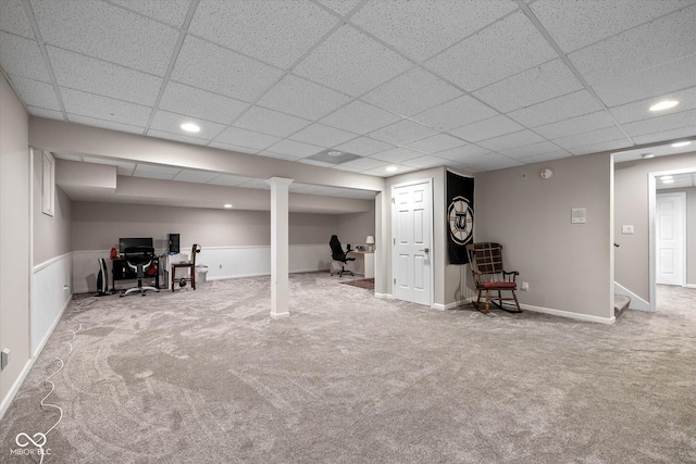 finished below grade area with stairs, baseboards, a drop ceiling, recessed lighting, and carpet