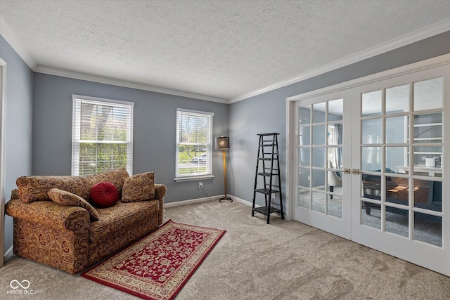 living area featuring carpet flooring, a textured ceiling, crown molding, and french doors