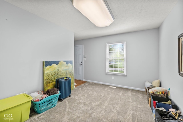 rec room featuring baseboards and carpet flooring