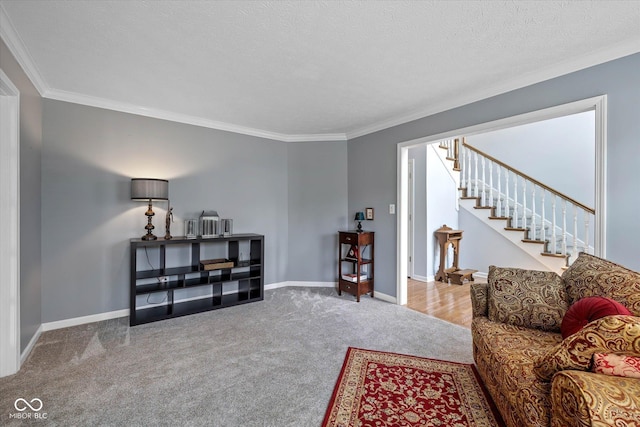 living area featuring stairs, baseboards, ornamental molding, and carpet floors