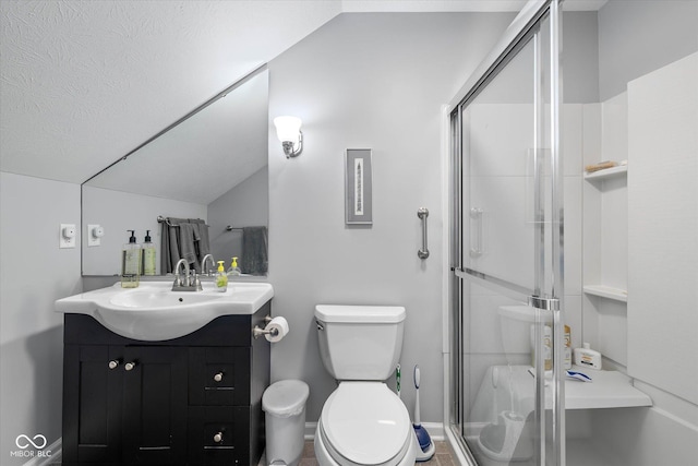 bathroom featuring vanity, vaulted ceiling, toilet, and a shower stall