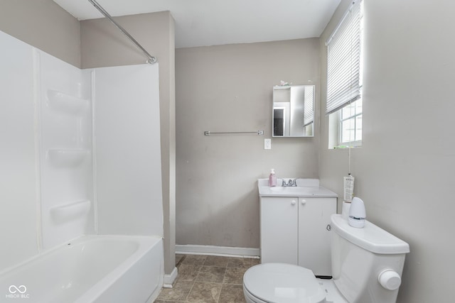 full bath featuring toilet, baseboards, bathtub / shower combination, and vanity
