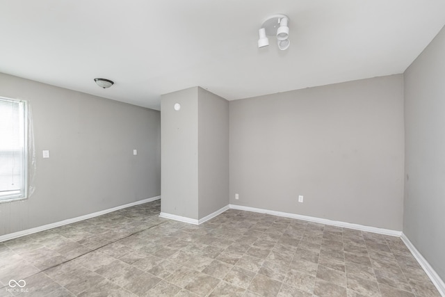 empty room with baseboards