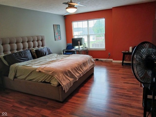 11651 Congressional Ln, Indianapolis, IN 46235 - bedroom with baseboards, ceiling fan, a textured ceiling, and dark wood-style flooring