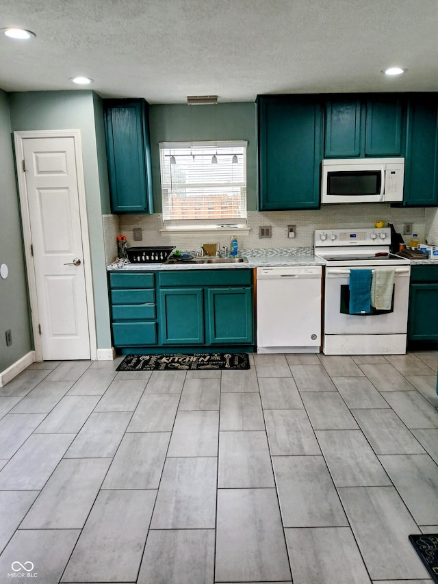11651 Congressional Ln, Indianapolis, IN 46235 - kitchen with a sink, green cabinets, white appliances, light countertops, and a textured ceiling