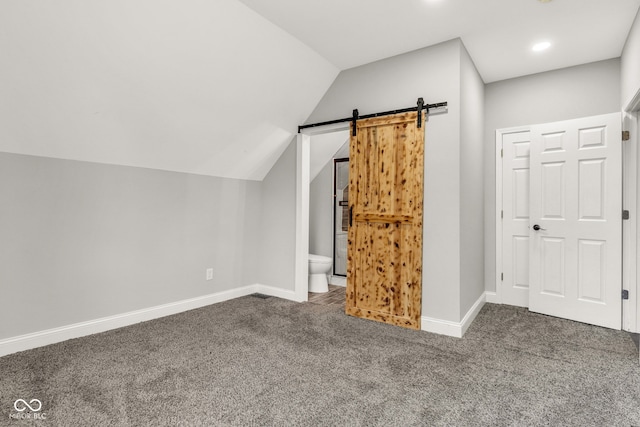 257 N Tacoma Ave, Indianapolis, IN 46201 - additional living space featuring lofted ceiling, a barn door, recessed lighting, carpet flooring, and baseboards