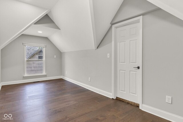 257 N Tacoma Ave, Indianapolis, IN 46201 - bonus room with recessed lighting, baseboards, dark wood-style flooring, visible vents, and vaulted ceiling
