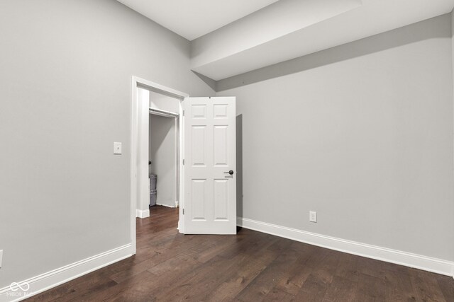 257 N Tacoma Ave, Indianapolis, IN 46201 - unfurnished room featuring baseboards and dark wood-style floors