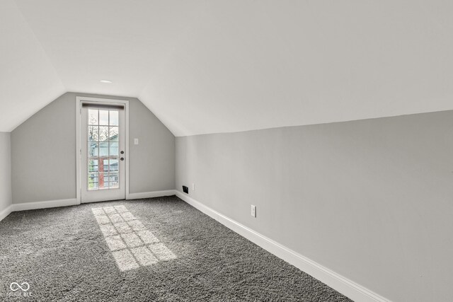 257 N Tacoma Ave, Indianapolis, IN 46201 - additional living space featuring baseboards, carpet flooring, and vaulted ceiling
