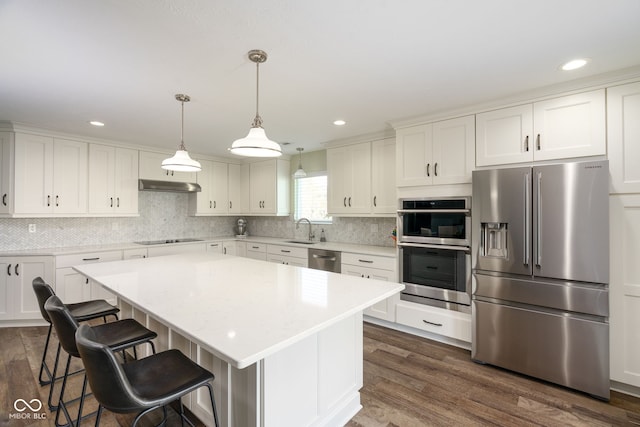 996 Denton Ct, Westfield, IN 46074 - kitchen featuring light countertops, white cabinetry, a sink, dark wood finished floors, and stainless steel appliances