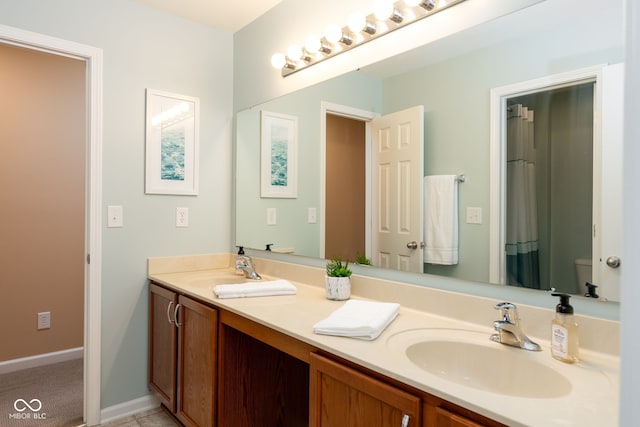 996 Denton Ct, Westfield, IN 46074 - full bath featuring a sink, baseboards, toilet, and double vanity