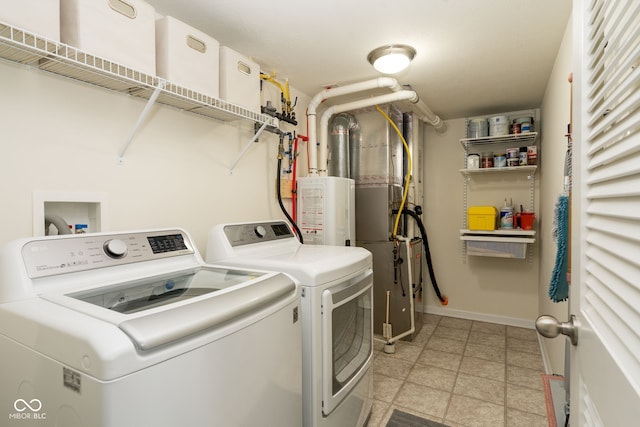 996 Denton Ct, Westfield, IN 46074 - clothes washing area with laundry area, washer and clothes dryer, baseboards, and water heater