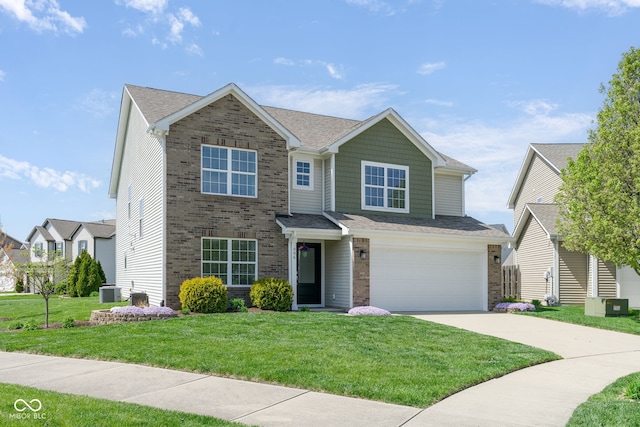 996 Denton Ct, Westfield, IN 46074 - traditional-style home featuring a garage, a front yard, brick siding, concrete driveway, and central air condition unit