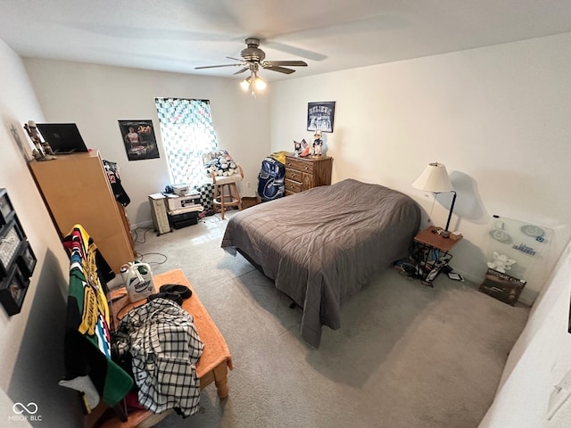 carpeted bedroom with a ceiling fan