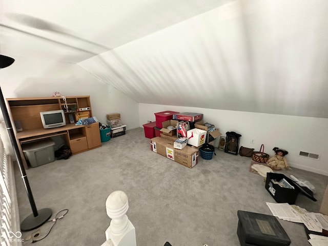 bonus room with carpet, visible vents, and lofted ceiling