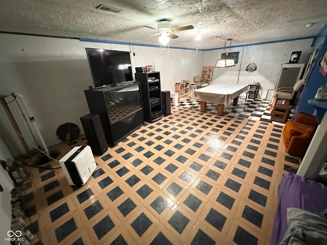 living area with a textured ceiling, ceiling fan, visible vents, tile patterned floors, and billiards