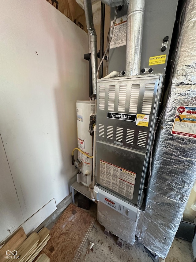 utility room featuring heating unit and water heater