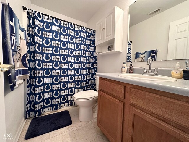 full bathroom featuring tile patterned floors, visible vents, toilet, and vanity